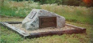 [Boulder with markings]